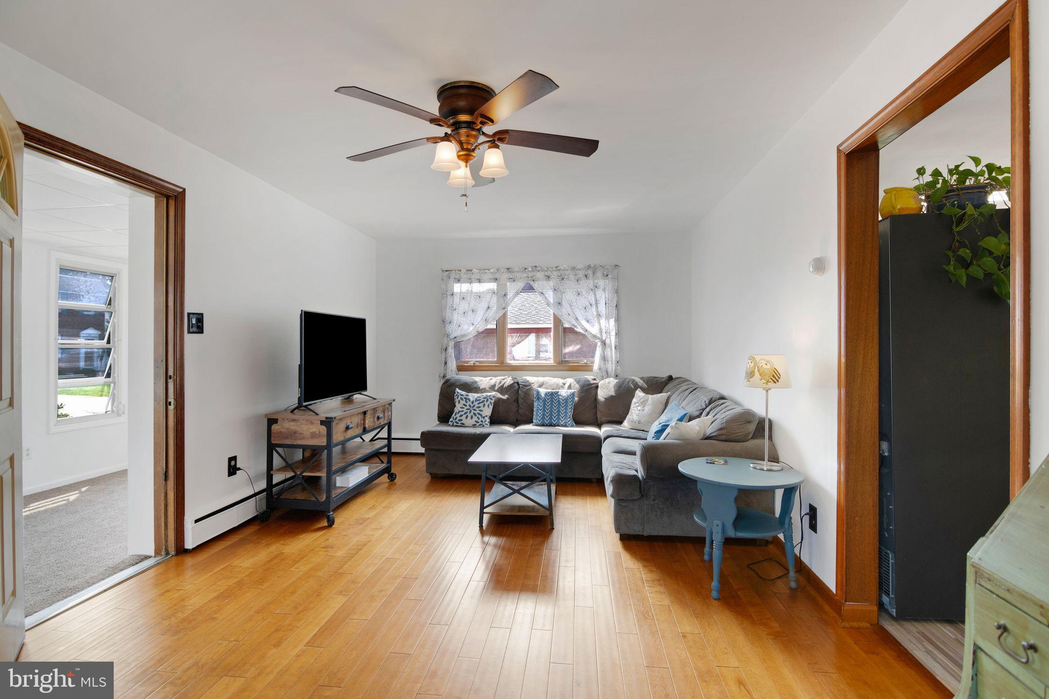 361 Amosland Road Holmes, PA 19043 - Photo 10 of 30 a living room with furniture and a flat screen tv