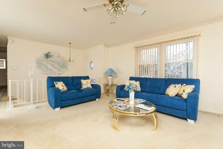 2001 Middleborough Road Baltimore, MD 21221 - Photo 4 of 30 a living room with furniture and a chandelier