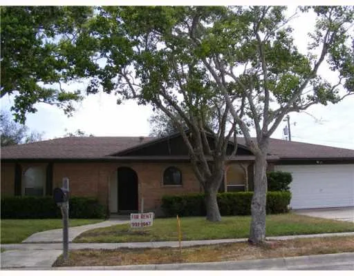 a front view of a house with yard