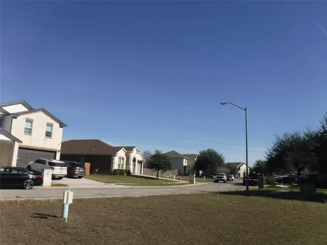 a view of outdoor space with deck and yard