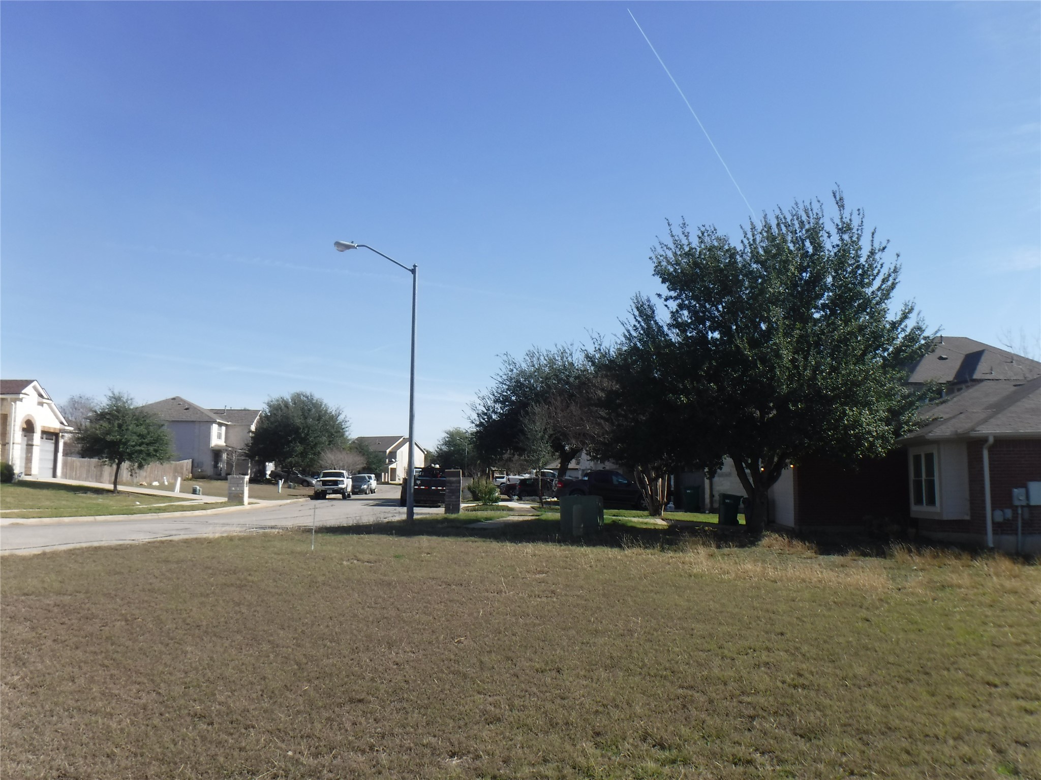 317 Gettysburg Loop Elgin, TX 78621 - Photo 12 of 14 View of grassy yard featuring a residential view