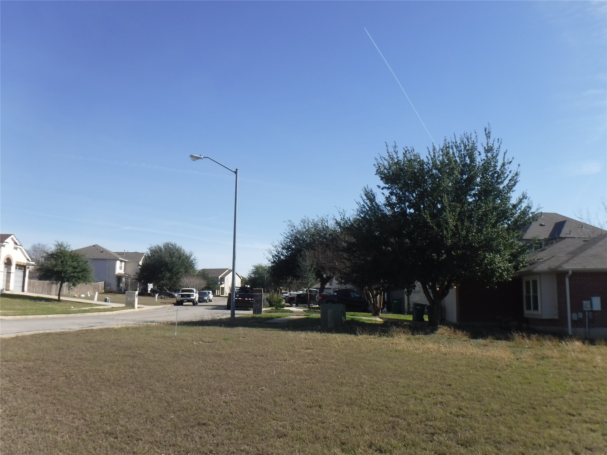 317 Gettysburg Loop Elgin, TX 78621 - Photo 6 of 14 View of green lawn featuring a residential view