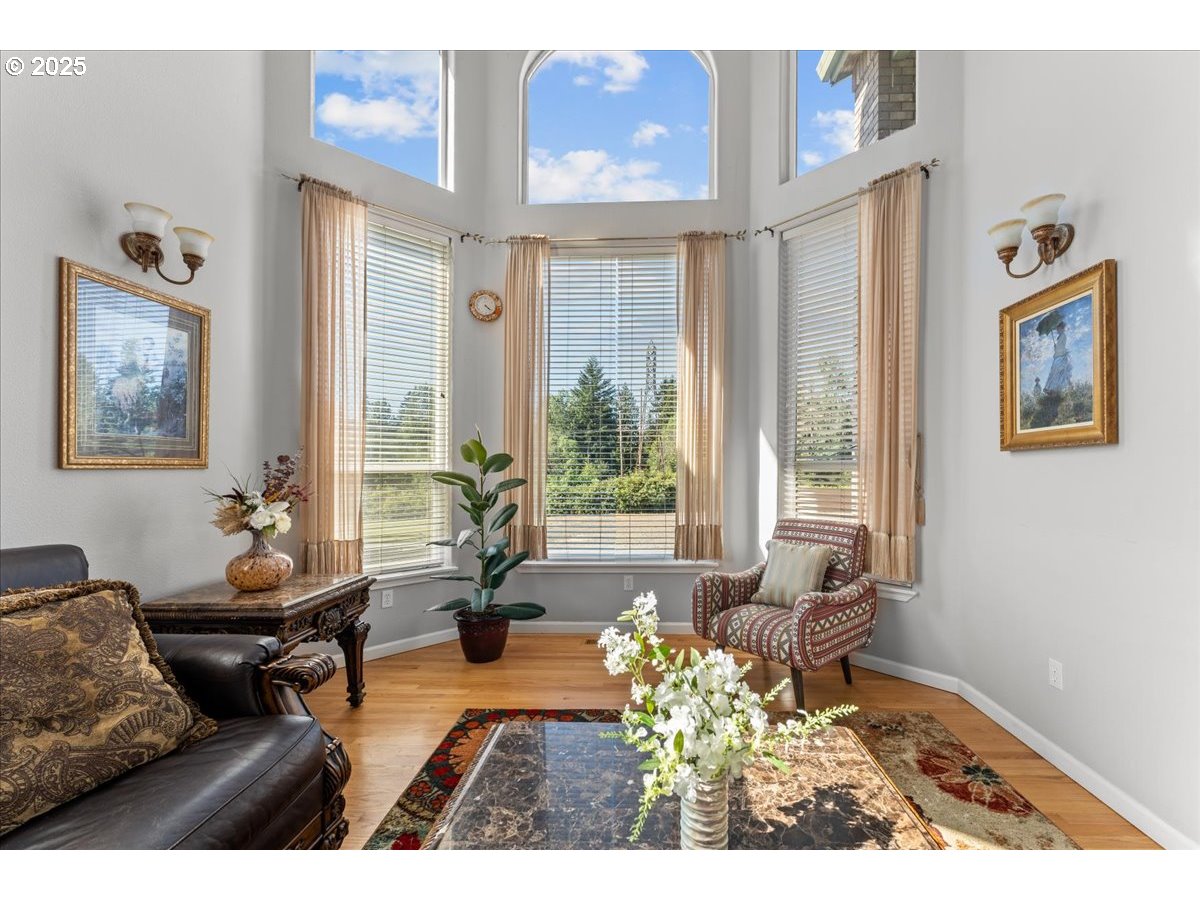5122 Southeast Jenne Road Portland, OR 97236 - Photo 16 of 36 a living room with furniture and a large window
