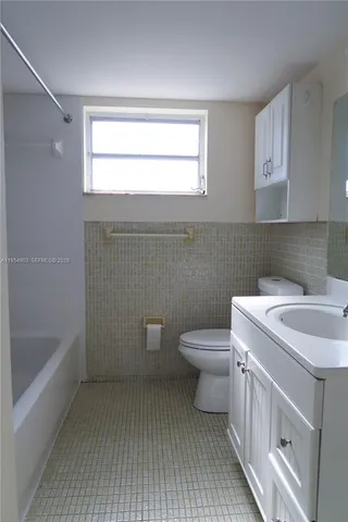a view of a bathroom with a bathtub