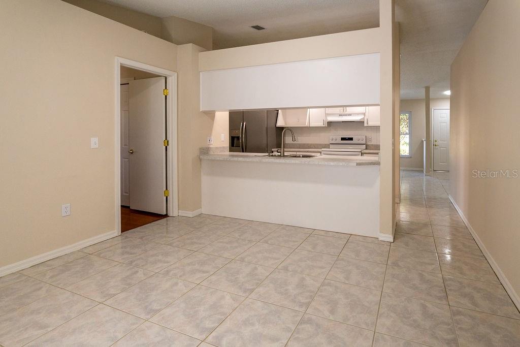 2405 Timbercreek Loop East Lakeland, FL 33805 - Photo 14 of 48 a view of kitchen and wooden floor