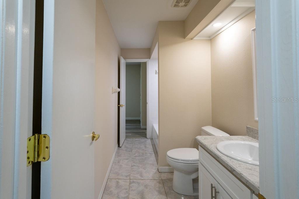 2405 Timbercreek Loop East Lakeland, FL 33805 - Photo 18 of 48 a bathroom with a toilet and a shower