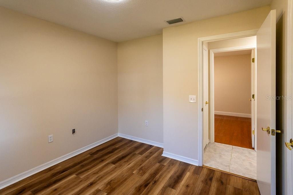 2405 Timbercreek Loop East Lakeland, FL 33805 - Photo 20 of 48 a view of a room with wooden floor and a bathroom