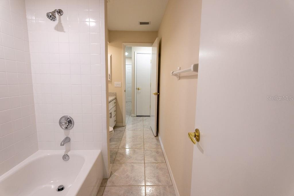 2405 Timbercreek Loop East Lakeland, FL 33805 - Photo 26 of 48 a bathroom with a bathtub and a shower