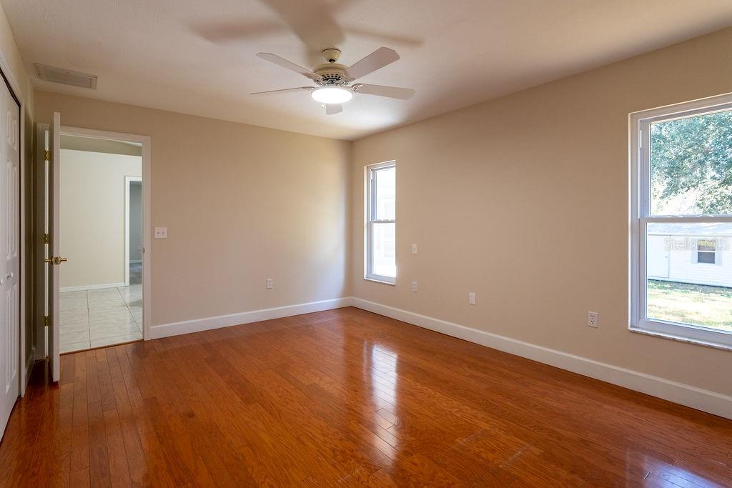 2405 Timbercreek Loop East Lakeland, FL 33805 - Photo 33 of 48 a view of an empty room with wooden floor and a window