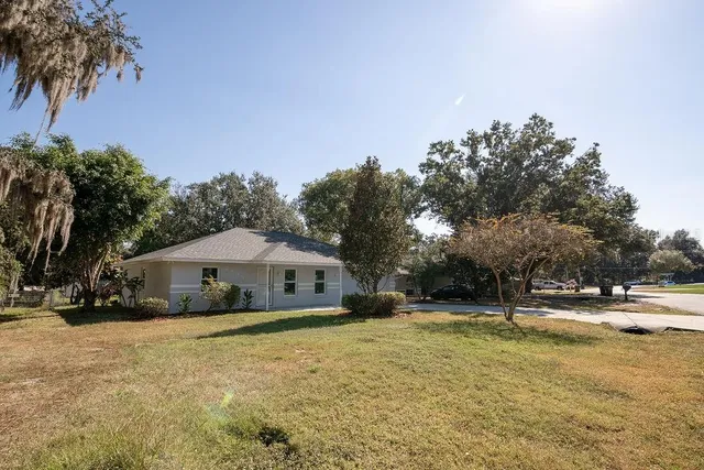 a house with swimming pool in front of it