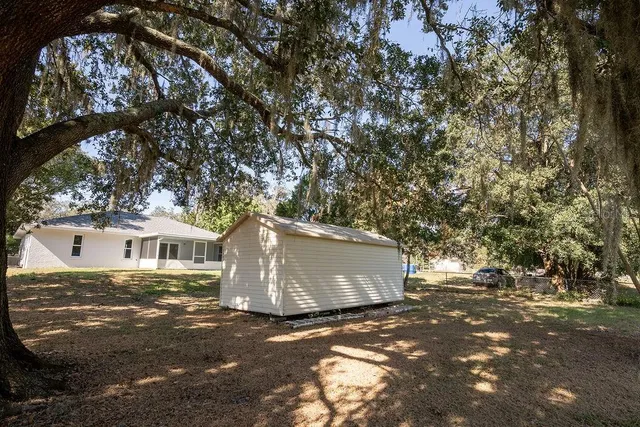 a view of house with yard