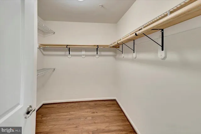 a bathroom with a tub sink shower and mirror