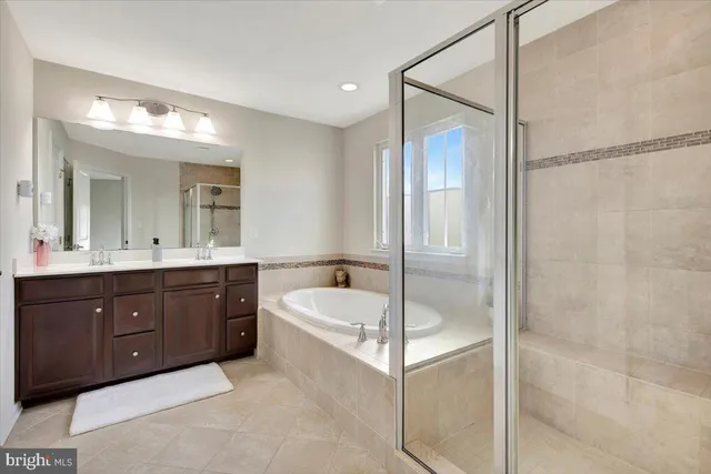 a bath tub sitting next to a window