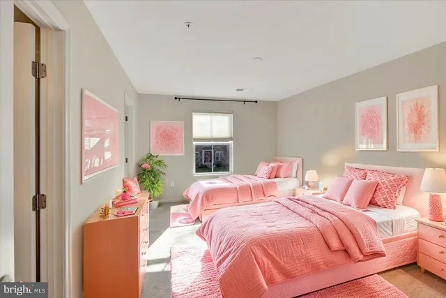 a bathroom with a sink vanity mirror and toilet
