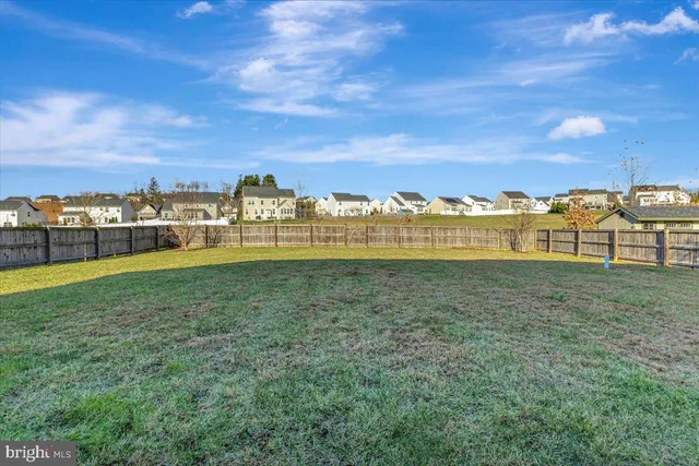 a view of a large yard with a city view