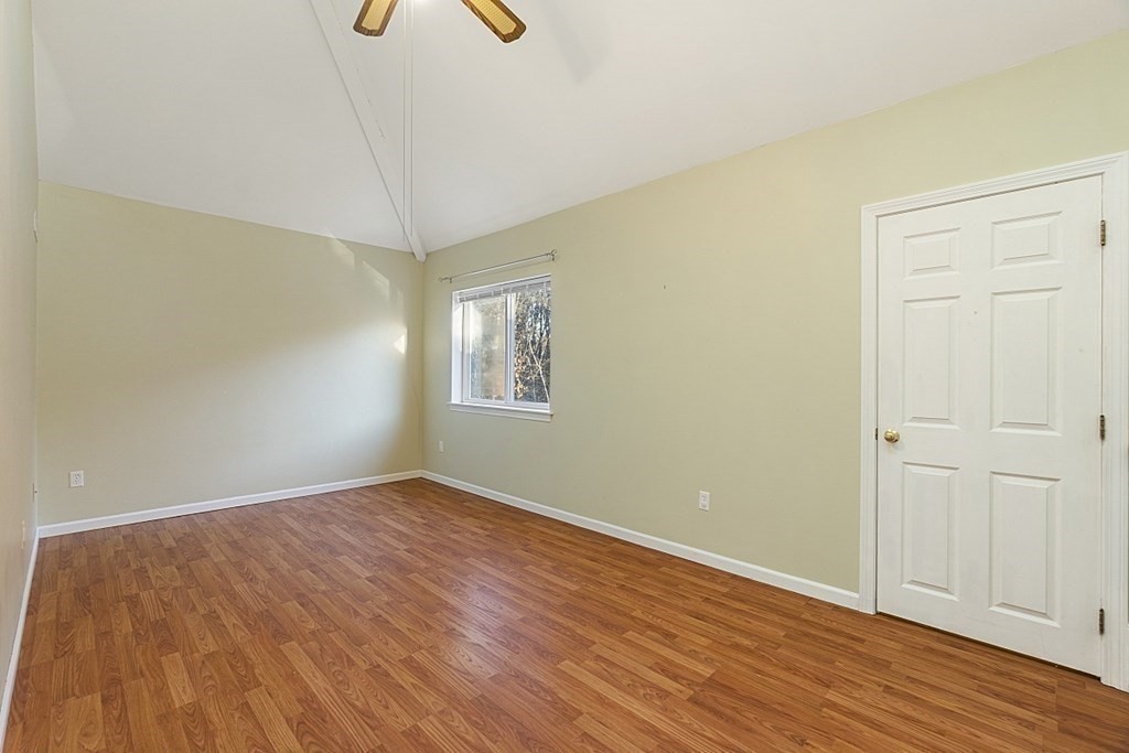 360 Littleton Road, Unit F2 Chelmsford, MA 01824 - Photo 12 of 27 wooden floor in an empty room with a window