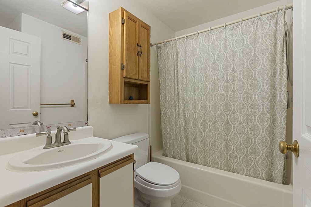 360 Littleton Road, Unit F2 Chelmsford, MA 01824 - Photo 14 of 27 a bathroom with a sink toilet and shower