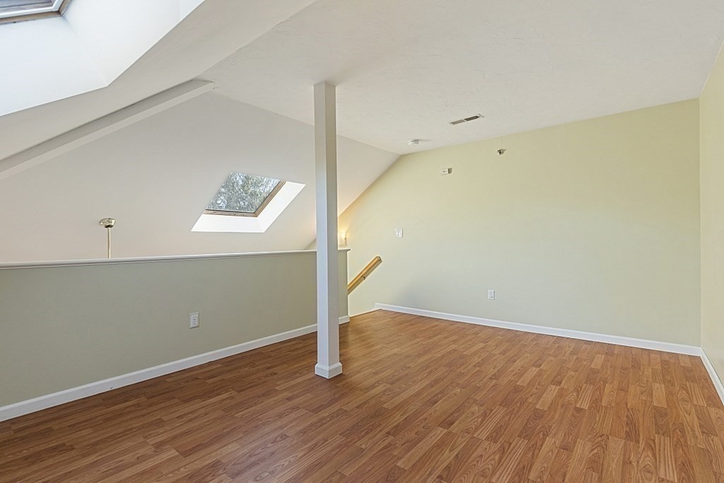 360 Littleton Road, Unit F2 Chelmsford, MA 01824 - Photo 16 of 27 an empty room with wooden floor