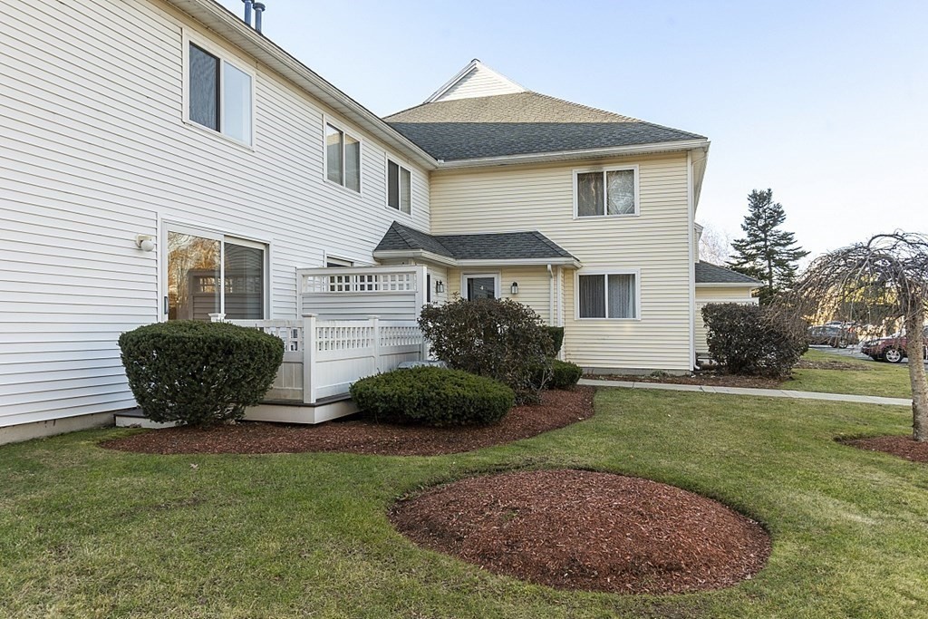 360 Littleton Road, Unit F2 Chelmsford, MA 01824 - Photo 3 of 27 a view of a house with a backyard