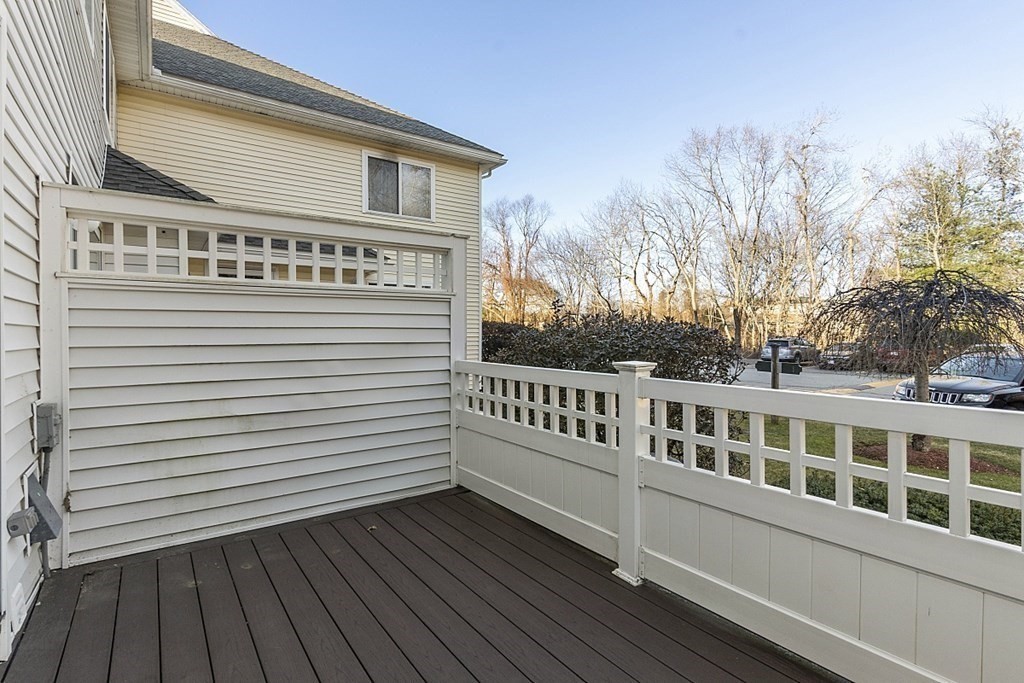 360 Littleton Road, Unit F2 Chelmsford, MA 01824 - Photo 4 of 27 a view of a house with a deck