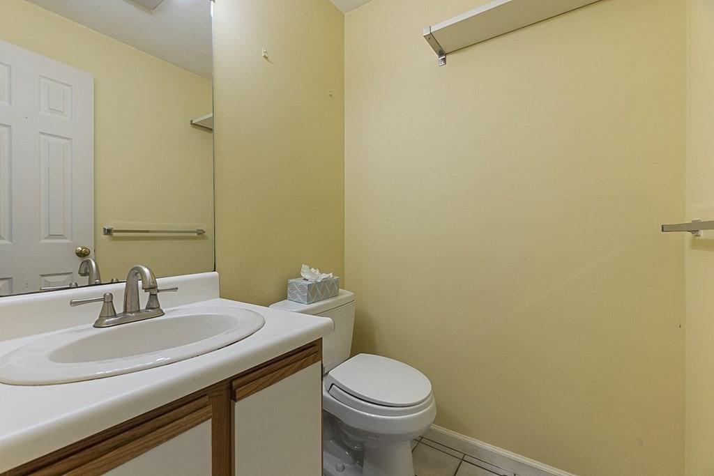 360 Littleton Road, Unit F2 Chelmsford, MA 01824 - Photo 10 of 27 a bathroom with a sink and a toilet