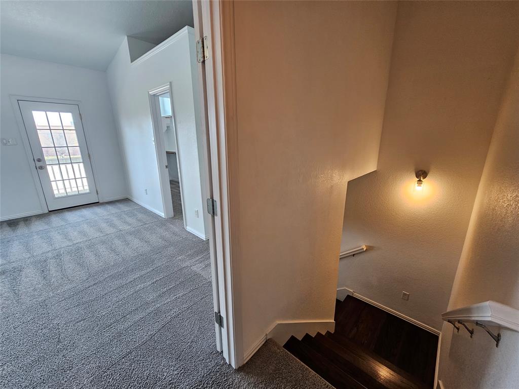 207 Starr Street Dallas, TX 75203 - Photo 12 of 28 Staircase featuring carpet and baseboards