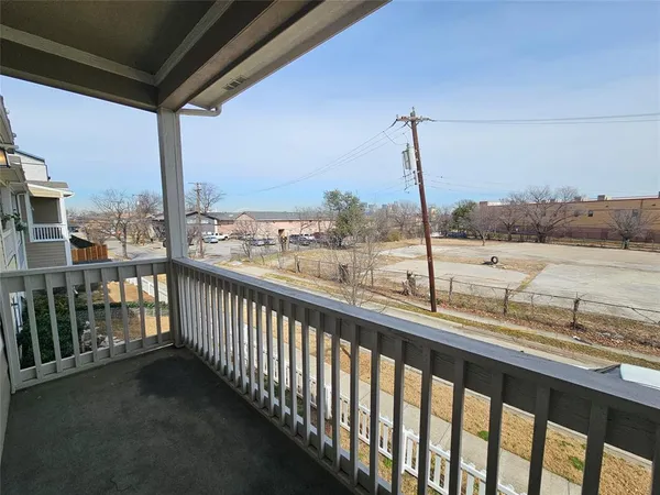 a view of an empty room with a kitchen