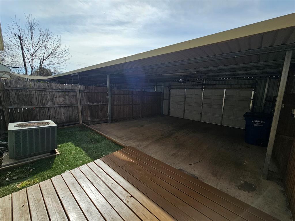 207 Starr Street Dallas, TX 75203 - Photo 26 of 28 Wooden deck with a garage
