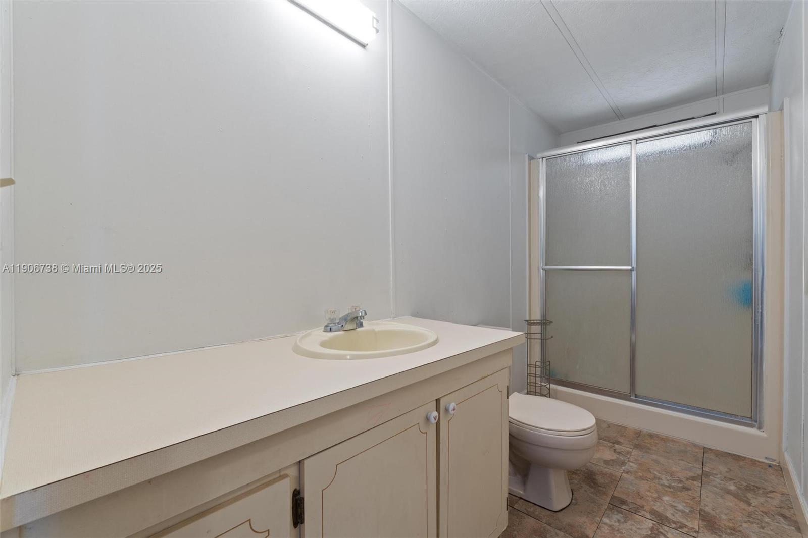 5305 Northwest 202nd Terrace Miami Gardens, FL 33055 - Photo 20 of 40 a bathroom with a sink a toilet and shower