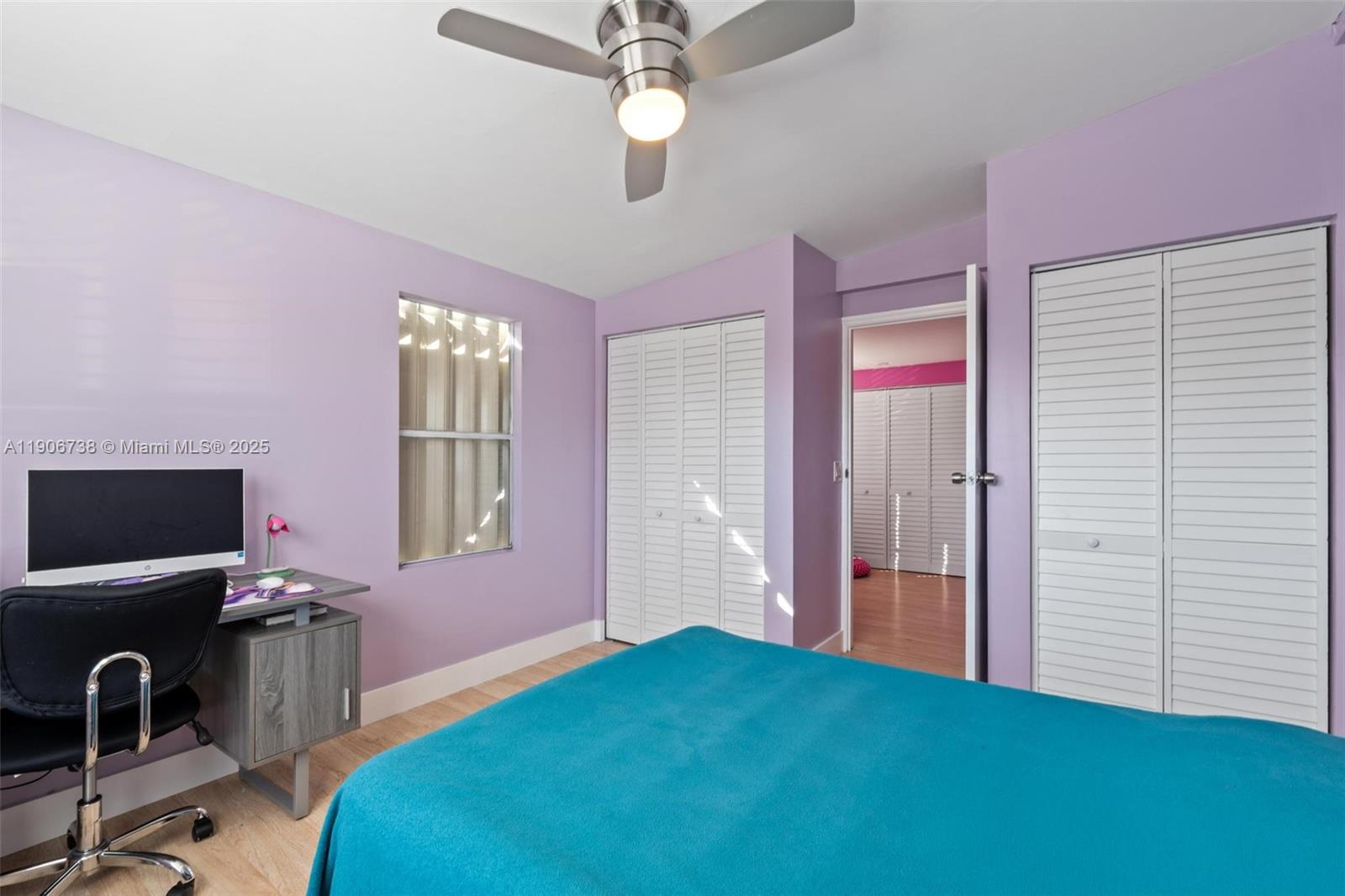 5305 Northwest 202nd Terrace Miami Gardens, FL 33055 - Photo 24 of 40 a bedroom with a bed and a desk