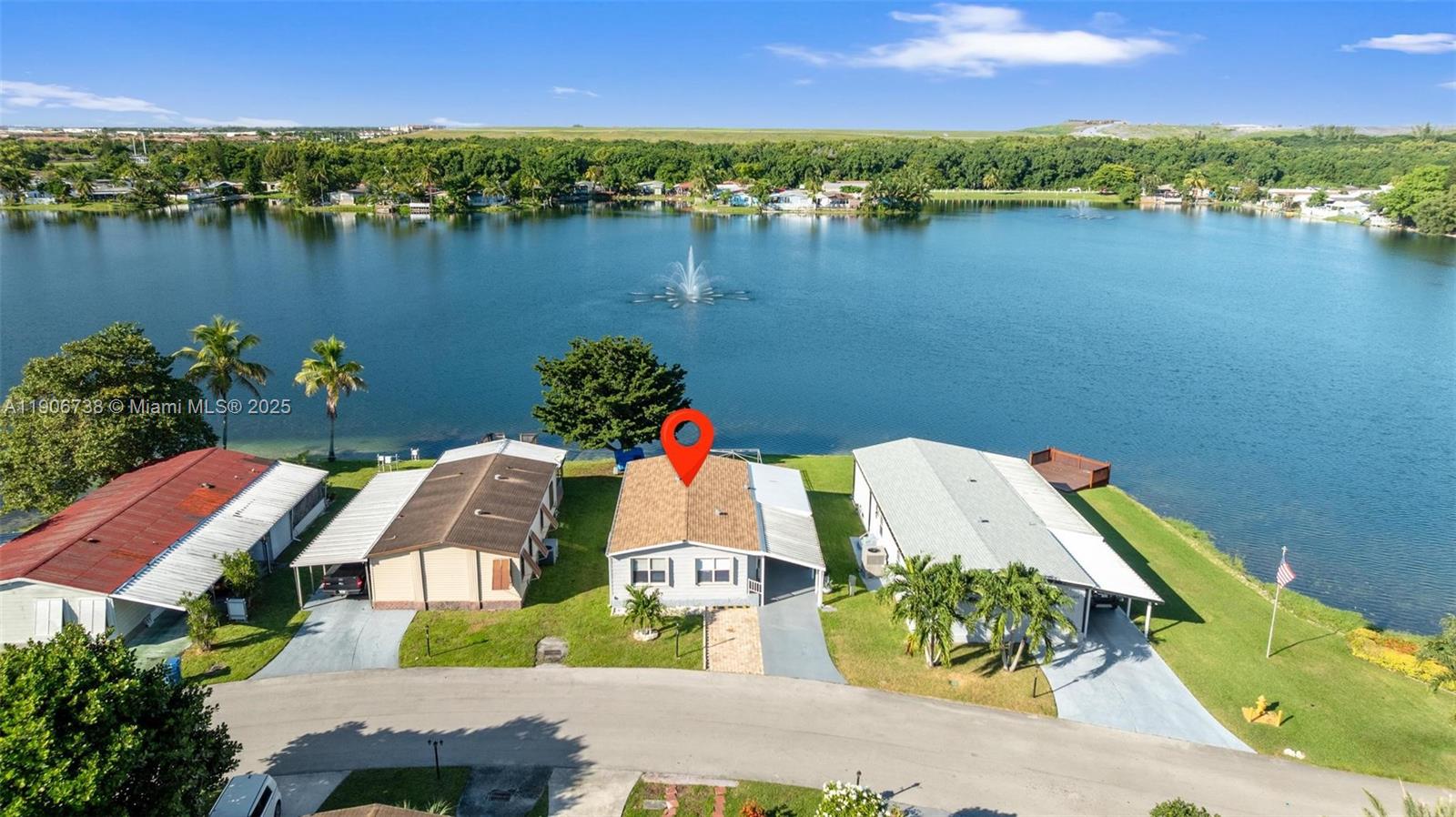 5305 Northwest 202nd Terrace Miami Gardens, FL 33055 - Photo 26 of 40 an aerial view of residential houses with outdoor space and lake view