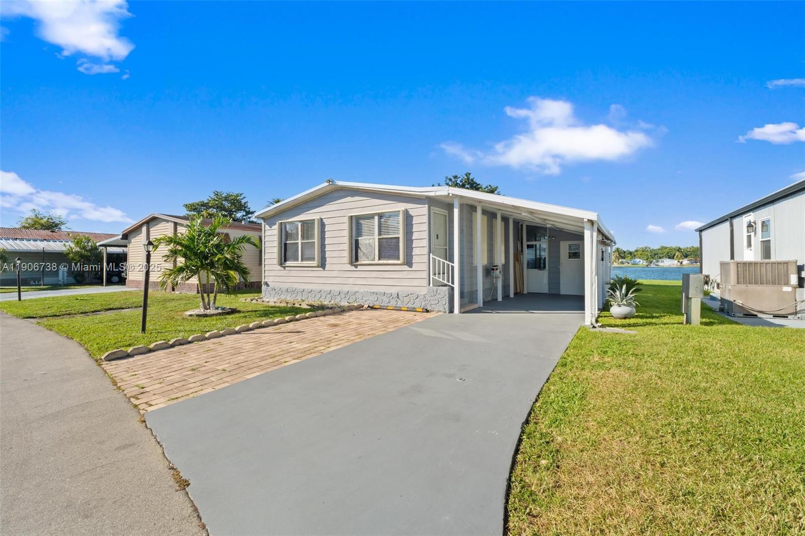 5305 Northwest 202nd Terrace Miami Gardens, FL 33055 - Photo 3 of 40 a view of a house with a yard