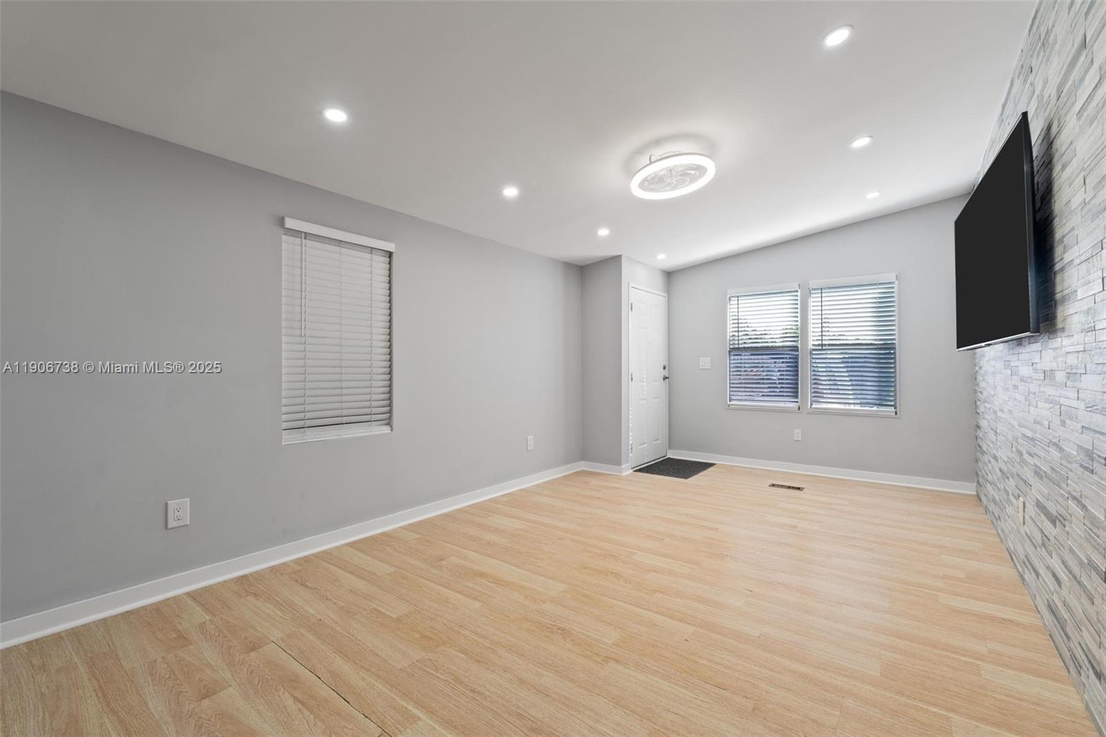 5305 Northwest 202nd Terrace Miami Gardens, FL 33055 - Photo 8 of 40 a view of an empty room with a window and fireplace