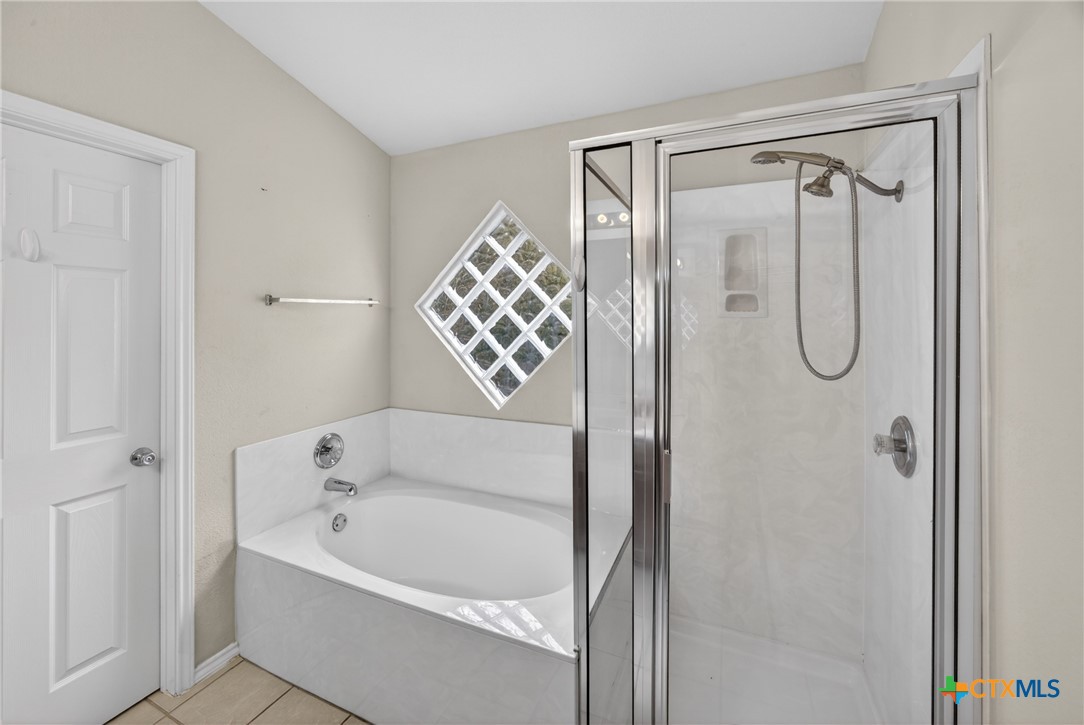7015 Rickey Drive Temple, TX 76502 - Photo 17 of 29 a bathroom with a bathtub shower and a sink
