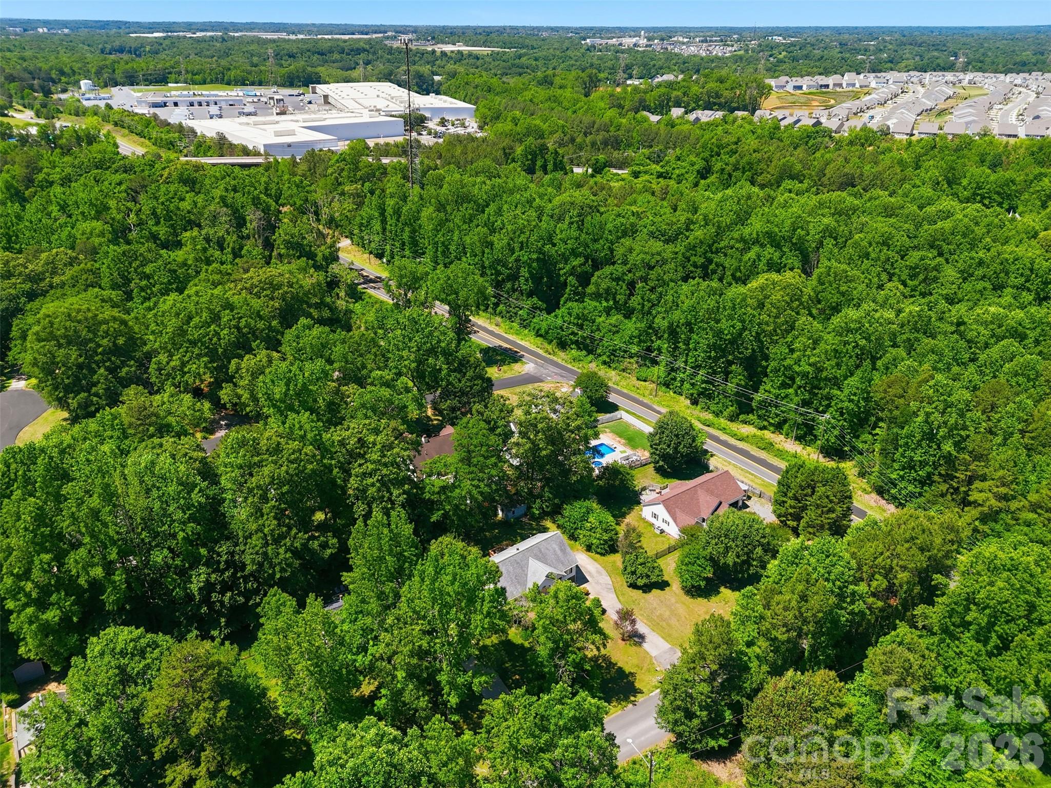913 Pleasant Ridge Road Fort Mill, SC 29715 - Photo 40 of 40 an aerial view of residential houses with outdoor space and trees
