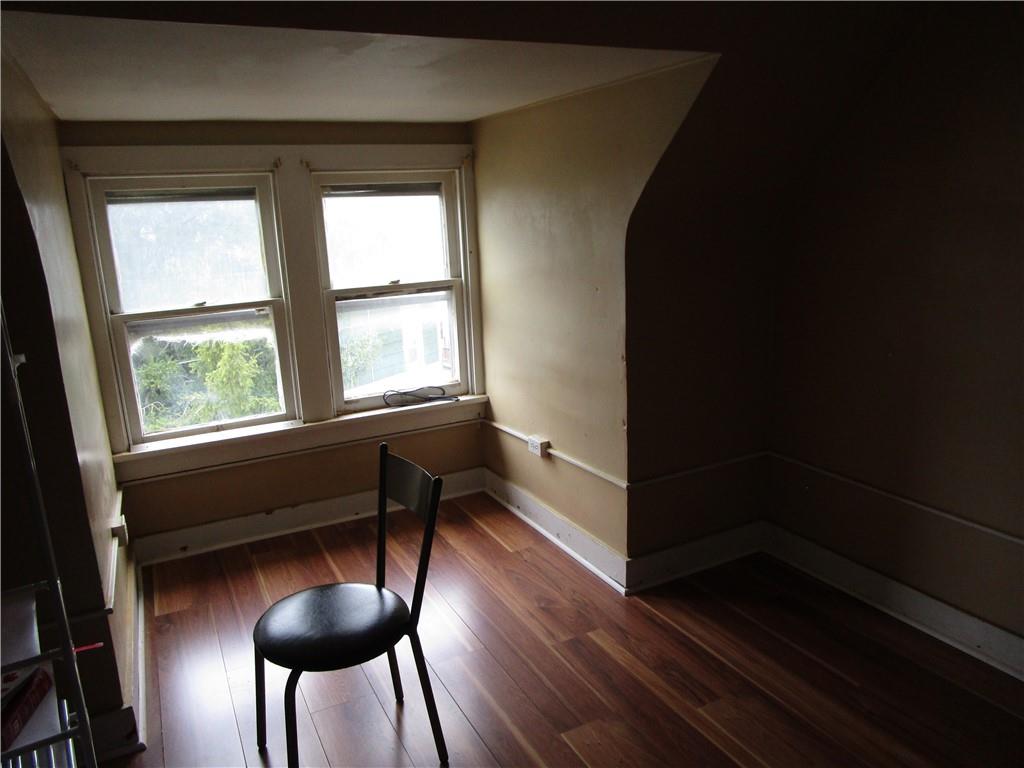 220 Mercer Street Butler, PA 16001 - Photo 11 of 12 a view of a livingroom with furniture and hardwood floor