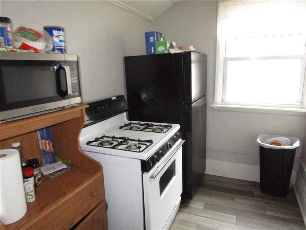 220 Mercer Street Butler, PA 16001 - Photo 5 of 12 a kitchen with a stove and a refrigerator