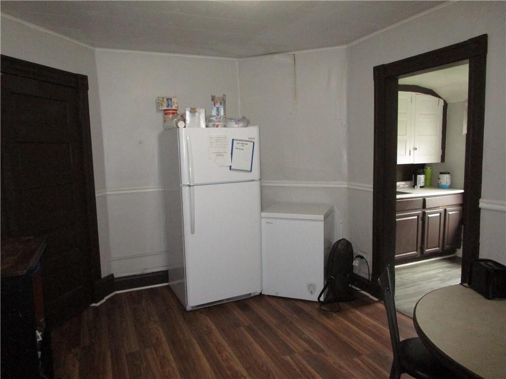 220 Mercer Street Butler, PA 16001 - Photo 7 of 12 a room with a chair and wooden floor
