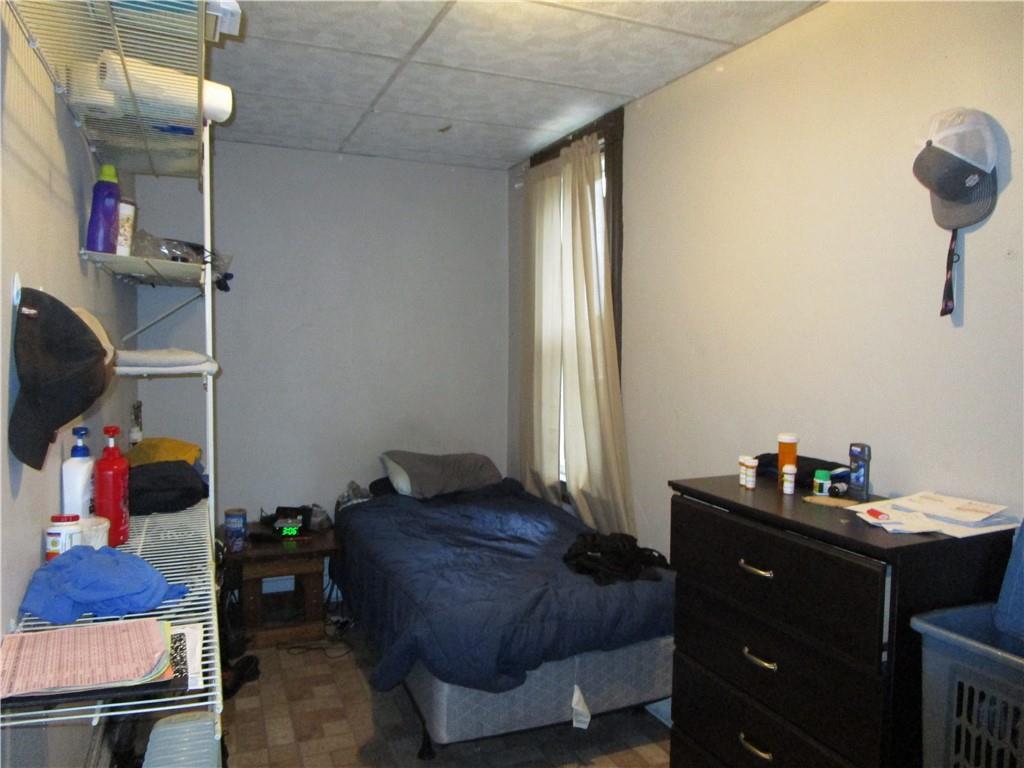 220 Mercer Street Butler, PA 16001 - Photo 9 of 12 a bedroom with a bed and cabinets