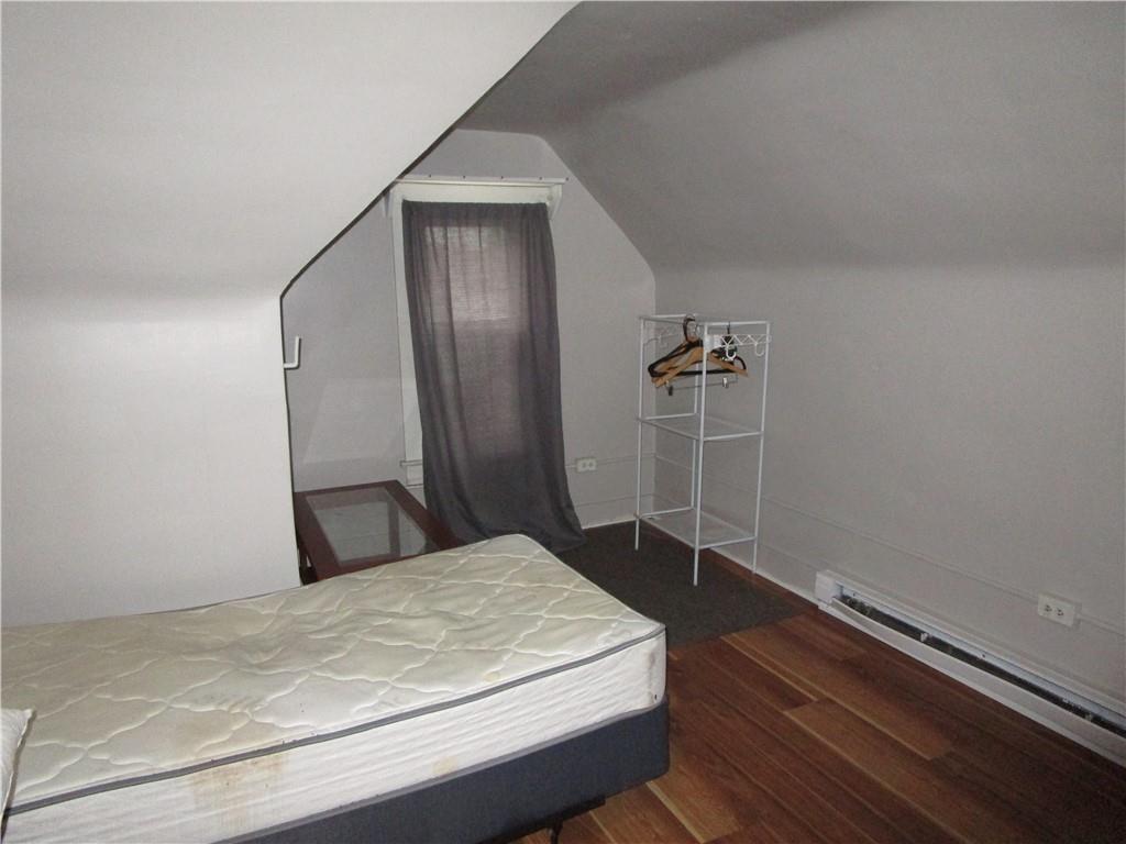 220 Mercer Street Butler, PA 16001 - Photo 10 of 12 a bedroom with a bed and a mirror