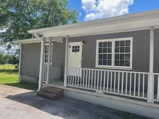 a porch with a bench