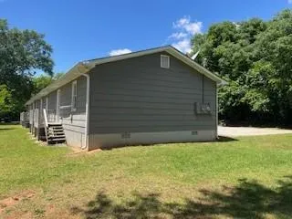 a backyard of a house with yard and garage