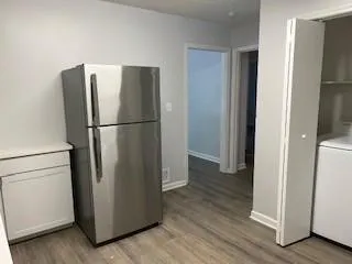 a white refrigerator freezer sitting in a kitchen