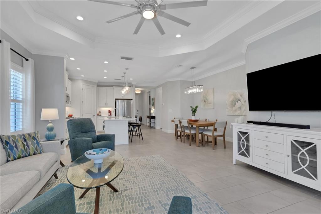 2194 Marquesa Circle Naples, FL 34112 - Photo 11 of 38 a living room with furniture and a flat screen tv