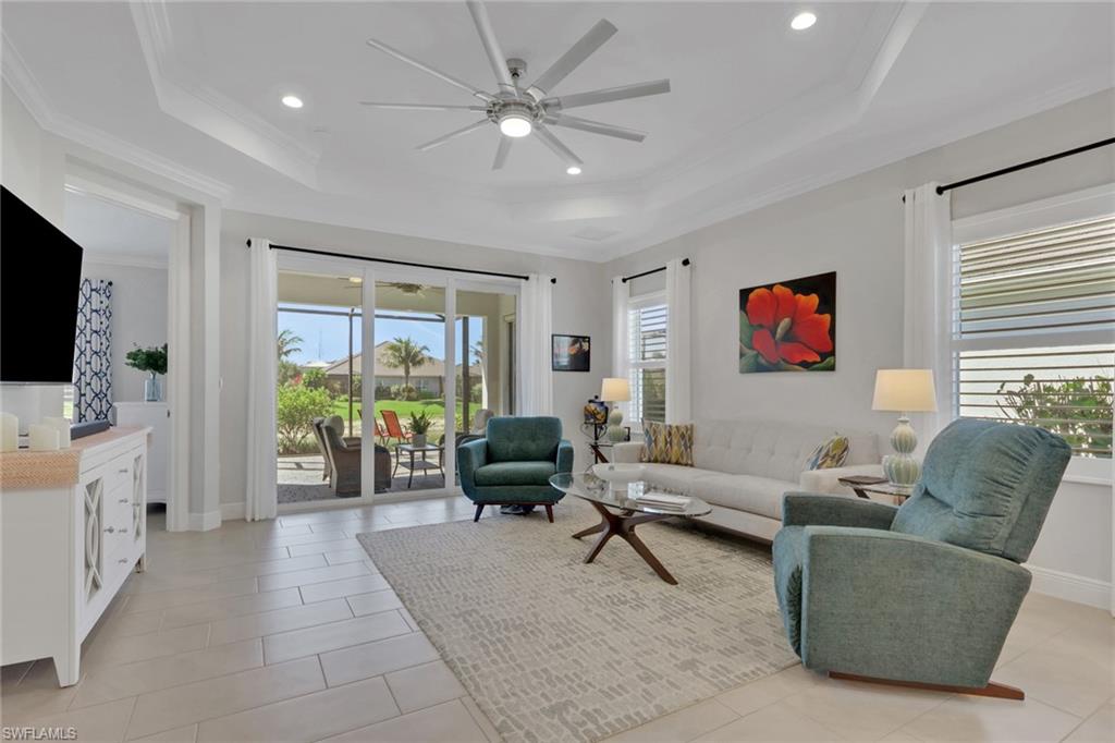 2194 Marquesa Circle Naples, FL 34112 - Photo 12 of 38 a living room with furniture and a flat screen tv