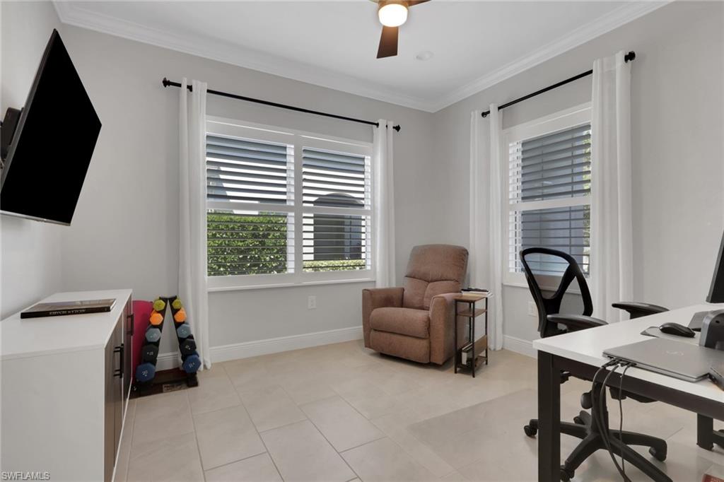 2194 Marquesa Circle Naples, FL 34112 - Photo 20 of 38 a living room with furniture and a flat screen tv
