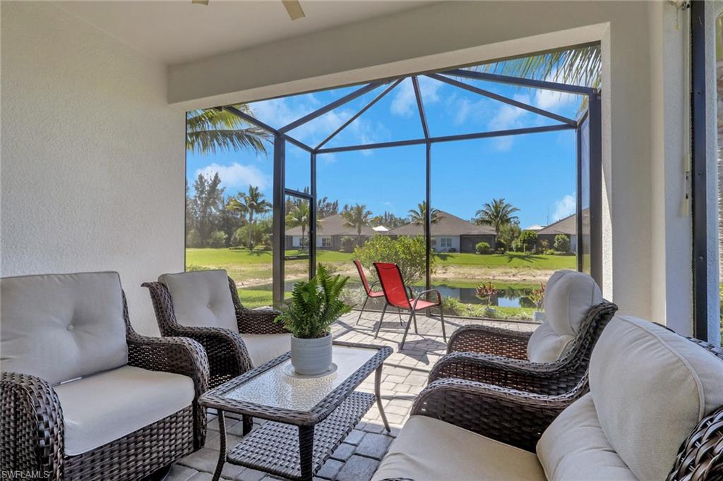 2194 Marquesa Circle Naples, FL 34112 - Photo 22 of 38 a living room with furniture and a floor to ceiling window