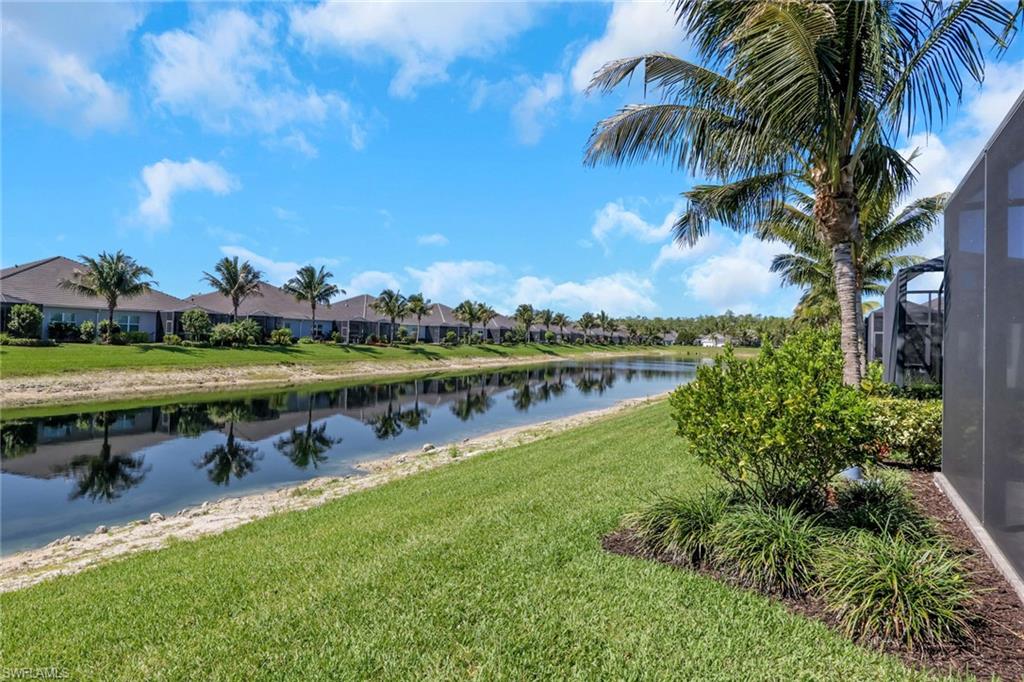 2194 Marquesa Circle Naples, FL 34112 - Photo 24 of 38 a view of a lake with a big yard