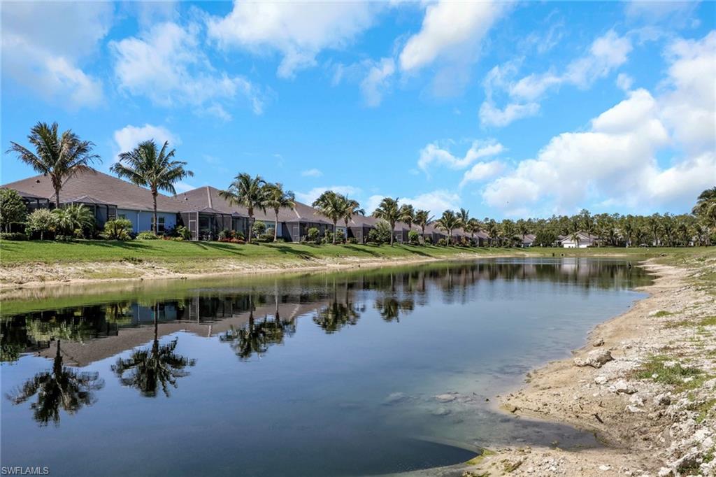 2194 Marquesa Circle Naples, FL 34112 - Photo 25 of 38 a view of a lake with houses in the back