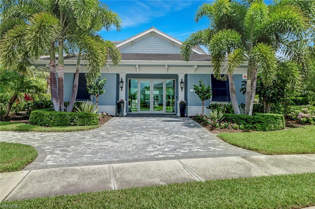 2194 Marquesa Circle Naples, FL 34112 - Photo 28 of 38 a front view of a house with garden